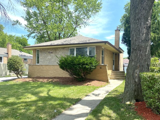 16009 Debbie Ln, South Holland, IL 60473 - bungalow featuring a chimney, brick siding, and a front yard