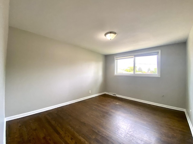 16009 Debbie Ln, South Holland, IL 60473 - spare room with dark wood-style floors