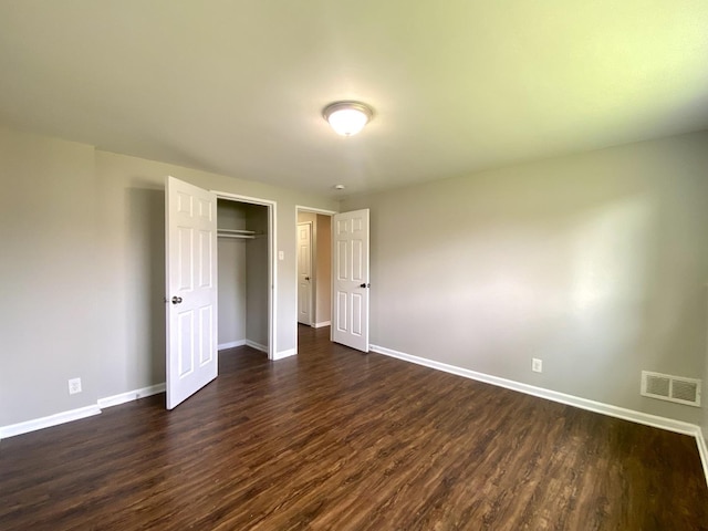 16009 Debbie Ln, South Holland, IL 60473 - unfurnished bedroom with dark wood-type flooring and a closet