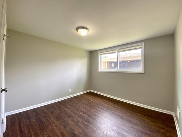 16009 Debbie Ln, South Holland, IL 60473 - empty room featuring dark wood finished floors and baseboards