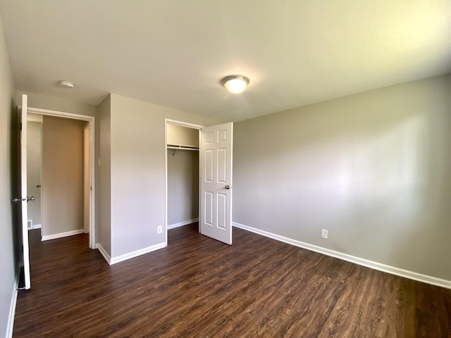 16009 Debbie Ln, South Holland, IL 60473 - unfurnished bedroom with dark wood-style floors and a closet