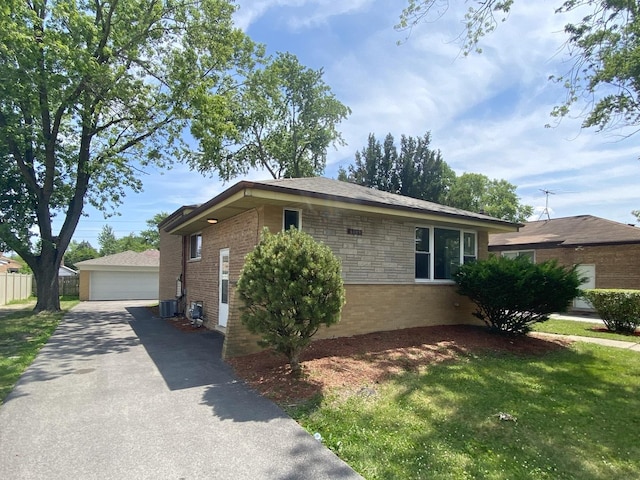 16009 Debbie Ln, South Holland, IL 60473 - view of front of home with a detached garage, an outdoor structure, and brick siding