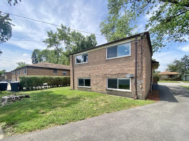 16009 Debbie Ln, South Holland, IL 60473 - view of front facade with a front lawn and brick siding