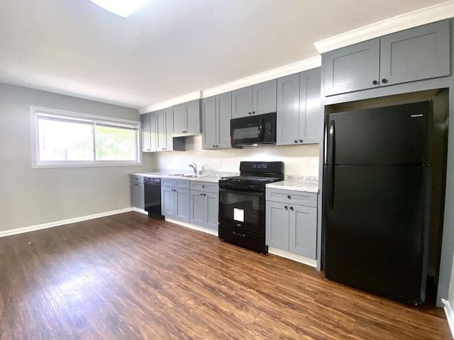 16009 Debbie Ln, South Holland, IL 60473 - kitchen featuring black appliances, light countertops, dark wood finished floors, and gray cabinetry