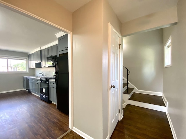 16009 Debbie Ln, South Holland, IL 60473 - kitchen featuring black appliances, dark wood finished floors, gray cabinetry, and light countertops