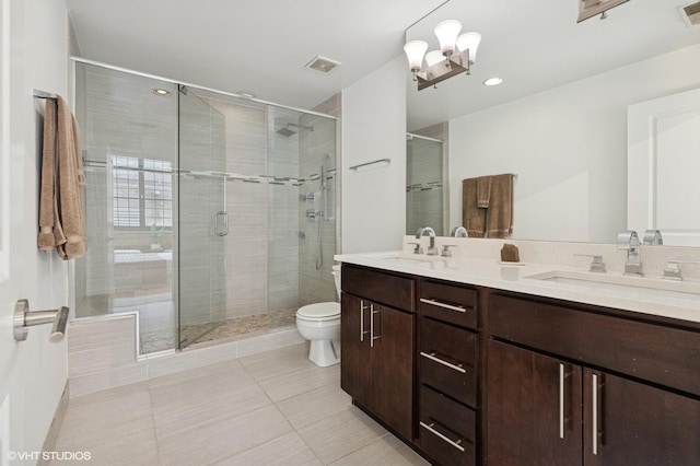 17 N Loomis St Unit 1C, Chicago, IL 60607 - bathroom with double vanity, a stall shower, tile patterned flooring, and recessed lighting