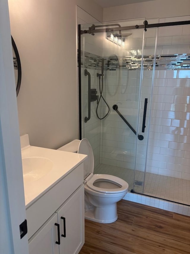 200 Park Ave Unit 634, Calumet City, IL 60409 - bathroom featuring vanity, wood finished floors, and a stall shower