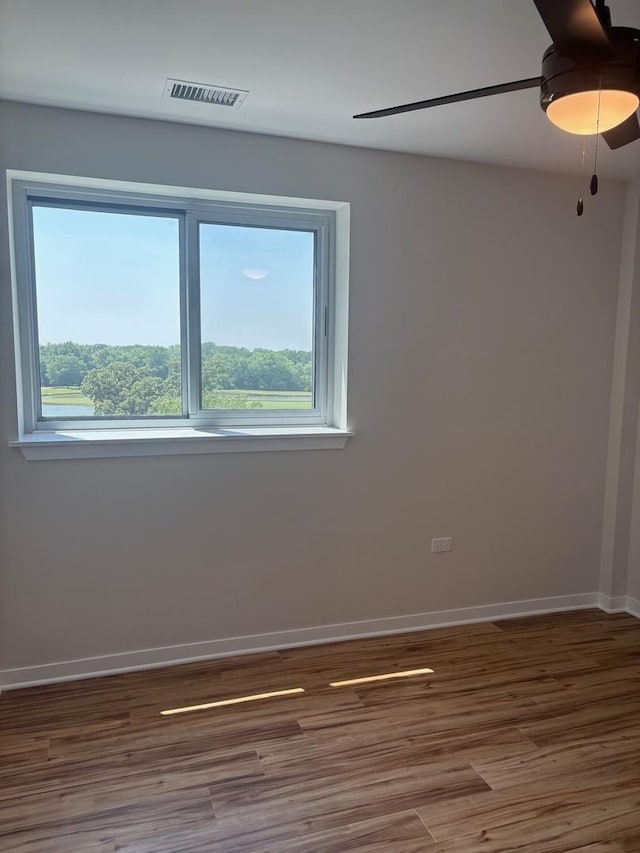 200 Park Ave Unit 634, Calumet City, IL 60409 - empty room featuring healthy amount of natural light, wood finished floors, and a ceiling fan