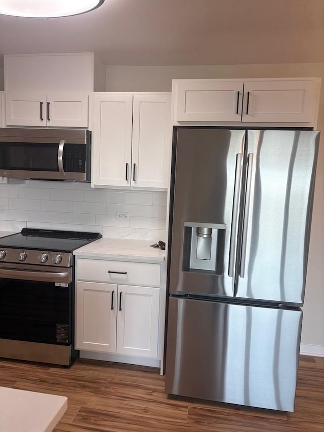 200 Park Ave Unit 634, Calumet City, IL 60409 - kitchen featuring appliances with stainless steel finishes, white cabinetry, and dark wood finished floors