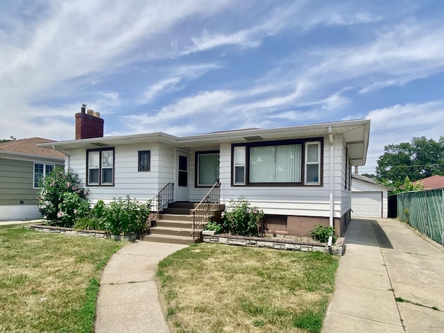 518 156th Pl, Calumet City, IL 60409 - ranch-style home with a chimney, an outbuilding, and a detached garage
