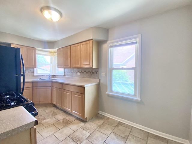 518 156th Pl, Calumet City, IL 60409 - kitchen with black appliances, light brown cabinets, light countertops, and decorative backsplash