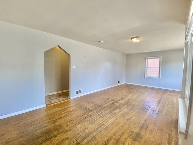 518 156th Pl, Calumet City, IL 60409 - spare room featuring light wood-style floors and arched walkways