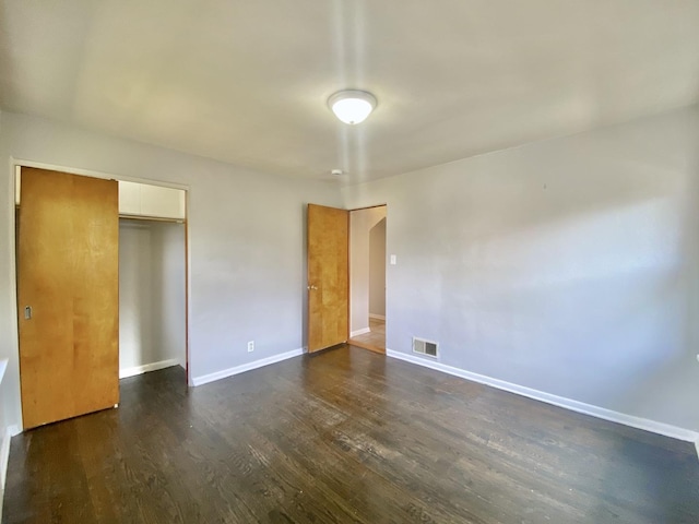 518 156th Pl, Calumet City, IL 60409 - unfurnished bedroom with dark wood-type flooring and a closet