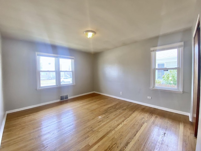 518 156th Pl, Calumet City, IL 60409 - empty room with plenty of natural light and wood finished floors