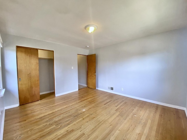 518 156th Pl, Calumet City, IL 60409 - unfurnished bedroom featuring light wood finished floors and a closet