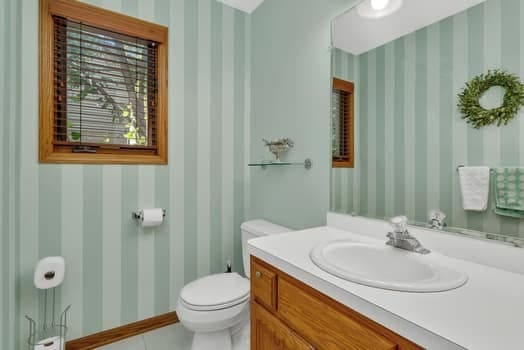 16620 Grants Trl, Orland Park, IL 60467 - bathroom featuring wallpapered walls, vanity, and tile patterned floors