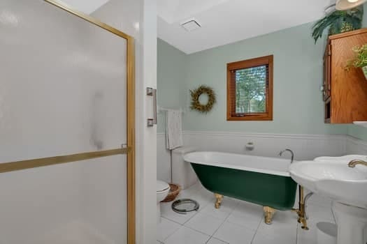 16620 Grants Trl, Orland Park, IL 60467 - full bathroom with tile patterned floors, a freestanding tub, and a shower stall