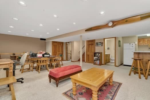 16620 Grants Trl, Orland Park, IL 60467 - living area with light colored carpet, bar area, stairs, and recessed lighting