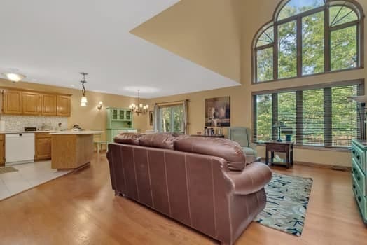 16620 Grants Trl, Orland Park, IL 60467 - living area with a chandelier and light wood finished floors
