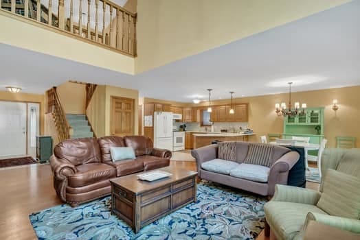 16620 Grants Trl, Orland Park, IL 60467 - living area featuring a chandelier, stairway, and a towering ceiling