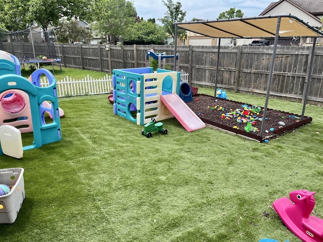 7347 W Benton Dr, Frankfort, IL 60423 - view of play area featuring a trampoline and a fenced backyard