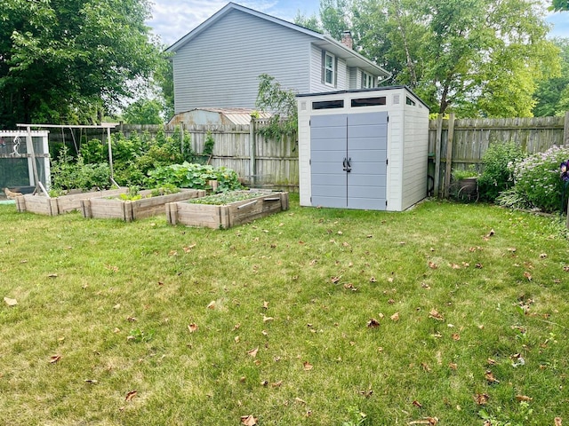 7347 W Benton Dr, Frankfort, IL 60423 - fenced backyard featuring a garden and a storage shed