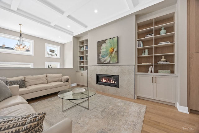 1642 W Wolfram St, Chicago, IL 60657 - living room with light wood-style floors, built in features, a high end fireplace, recessed lighting, and beamed ceiling
