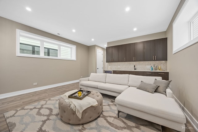 1642 W Wolfram St, Chicago, IL 60657 - living area with wet bar, light wood-style flooring, and recessed lighting
