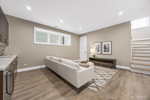 1642 W Wolfram St, Chicago, IL 60657 - living room featuring wood finished floors, stairs, recessed lighting, and beverage cooler