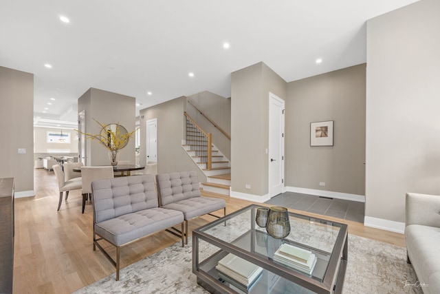 1642 W Wolfram St, Chicago, IL 60657 - living room with stairs, wood finished floors, and recessed lighting