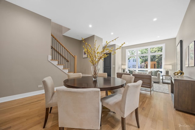 1642 W Wolfram St, Chicago, IL 60657 - dining area with light wood finished floors, recessed lighting, and stairway
