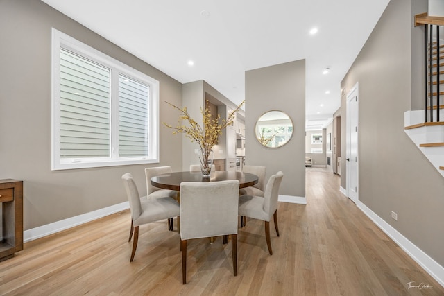 1642 W Wolfram St, Chicago, IL 60657 - dining space with light wood-style floors, stairs, and recessed lighting