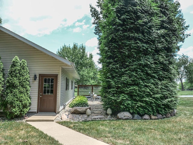 26 N Deer Lk, Villa Grove, IL 61956 - view of exterior entry featuring a yard