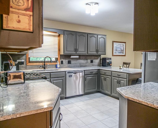 26 N Deer Lk, Villa Grove, IL 61956 - kitchen with gray cabinets, dishwasher, tasteful backsplash, light tile patterned flooring, and a peninsula