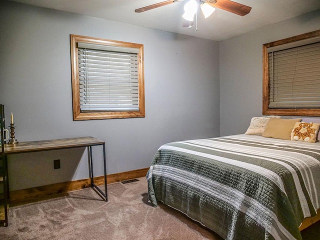 26 N Deer Lk, Villa Grove, IL 61956 - carpeted bedroom featuring baseboards and ceiling fan