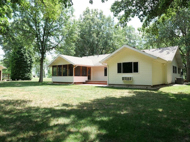 26 N Deer Lk, Villa Grove, IL 61956 - back of house with a sunroom and a lawn
