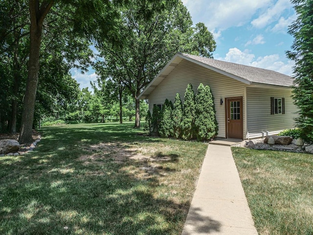26 N Deer Lk, Villa Grove, IL 61956 - view of front of home featuring a front yard and roof with shingles