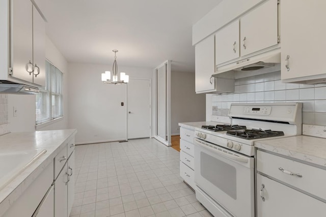 1108 Lancaster Ave, Elk Grove Village, IL 60007 - kitchen featuring white gas stove, under cabinet range hood, light countertops, tasteful backsplash, and a chandelier