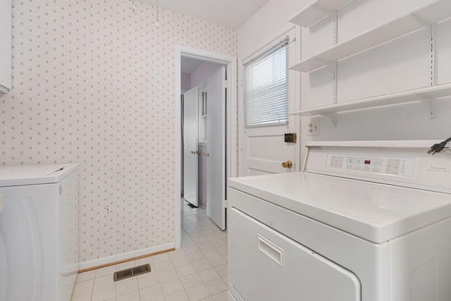 1108 Lancaster Ave, Elk Grove Village, IL 60007 - washroom with wallpapered walls, washer and clothes dryer, and light tile patterned floors
