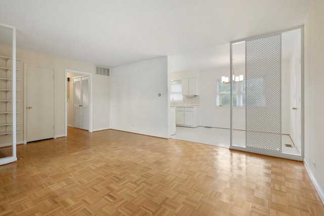 1108 Lancaster Ave, Elk Grove Village, IL 60007 - unfurnished bedroom featuring a chandelier and baseboards