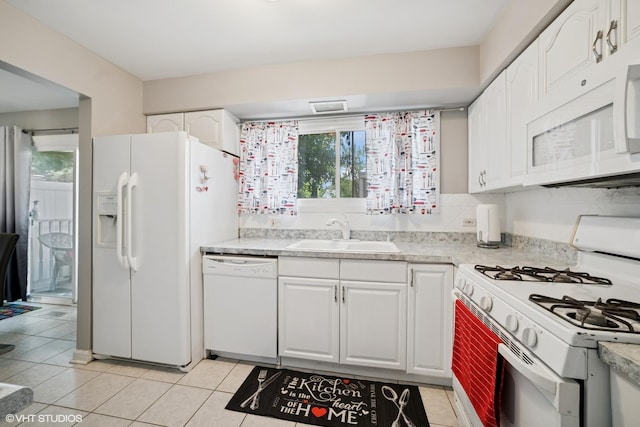 1117 Sausalito Ct Unit 1117, Bartlett, IL 60103 - kitchen with white appliances, light tile patterned floors, white cabinetry, and light countertops