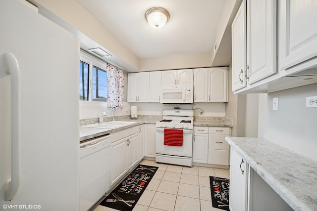 1117 Sausalito Ct Unit 1117, Bartlett, IL 60103 - kitchen with white appliances, white cabinetry, light tile patterned floors, and light countertops
