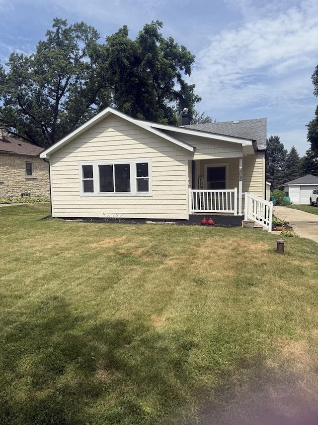 309 SE Circle Dr, Joliet, IL 60433 - view of front of home featuring a porch and a front lawn