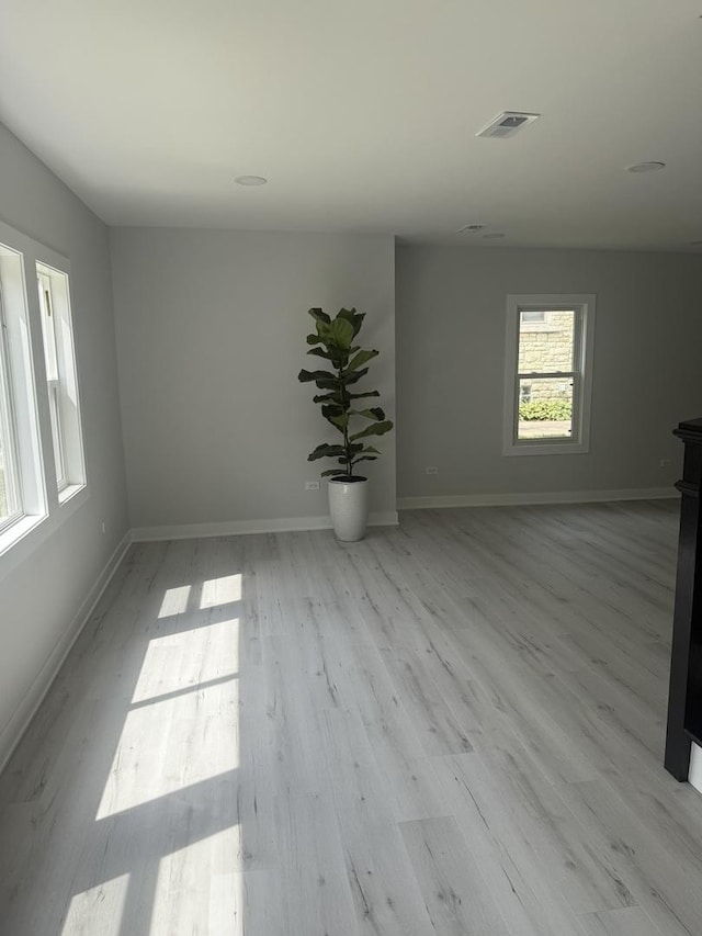309 SE Circle Dr, Joliet, IL 60433 - spare room with light wood-type flooring and baseboards