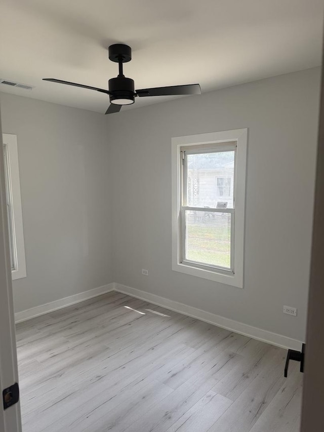 309 SE Circle Dr, Joliet, IL 60433 - spare room with wood finished floors and ceiling fan
