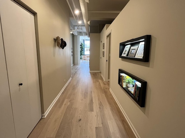 124 W Polk St Unit 203, Chicago, IL 60605 - hallway with light wood-style floors and baseboards