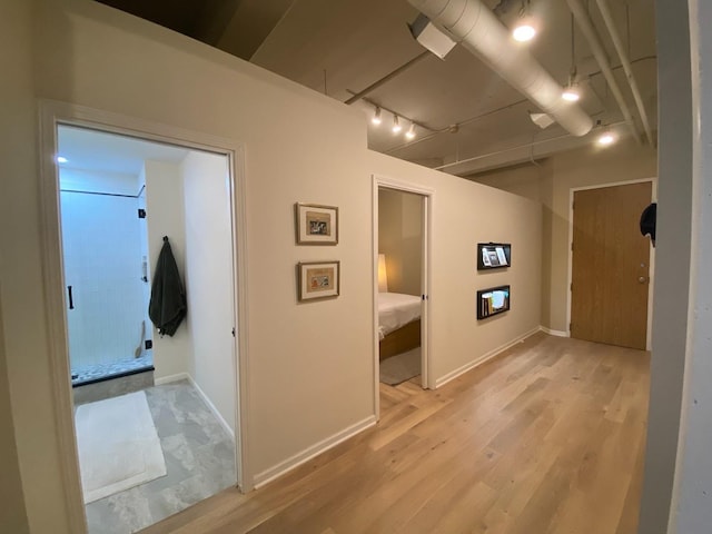 124 W Polk St Unit 203, Chicago, IL 60605 - corridor with light wood-type flooring and rail lighting