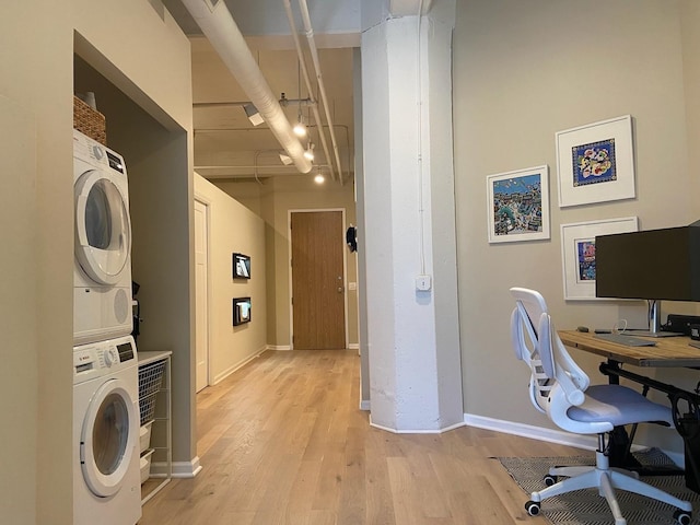 124 W Polk St Unit 203, Chicago, IL 60605 - home office with stacked washer / drying machine and light wood-style floors