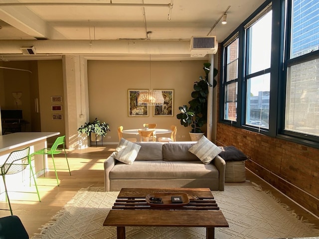 124 W Polk St Unit 203, Chicago, IL 60605 - living area featuring wood finished floors, a chandelier, and rail lighting
