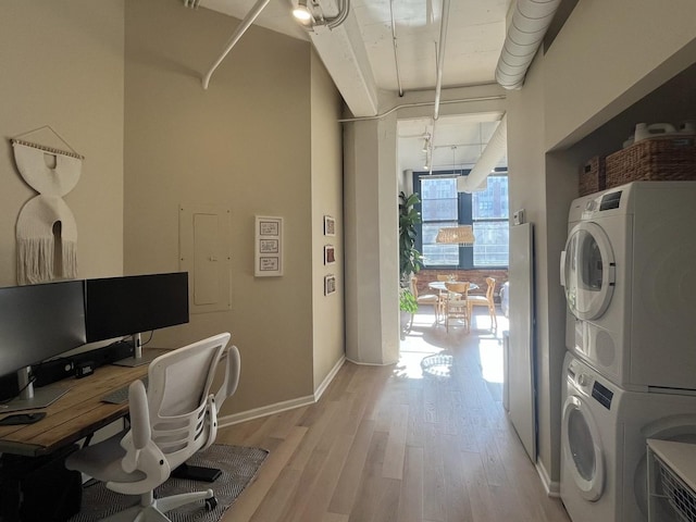 124 W Polk St Unit 203, Chicago, IL 60605 - washroom with stacked washer / dryer, light wood-style floors, and an office area